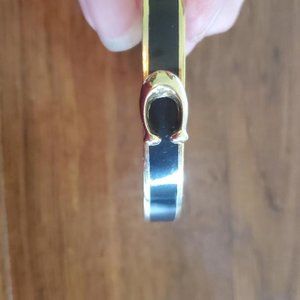 COACH Signature Black and Gold Hinged Bracelet